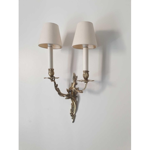 588 - A Pair Of Louis XV Style Wall Appliques In Gilt Bronze With Two Candles Agrafe Decor On Which Are Fi... 