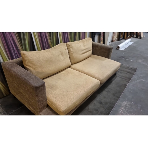 207 - A pair of large lobby sofas upholstered with loose cushions and polished metal legs 200 x 100 x 62cm... 