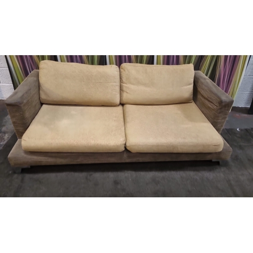 207 - A pair of large lobby sofas upholstered with loose cushions and polished metal legs 200 x 100 x 62cm... 