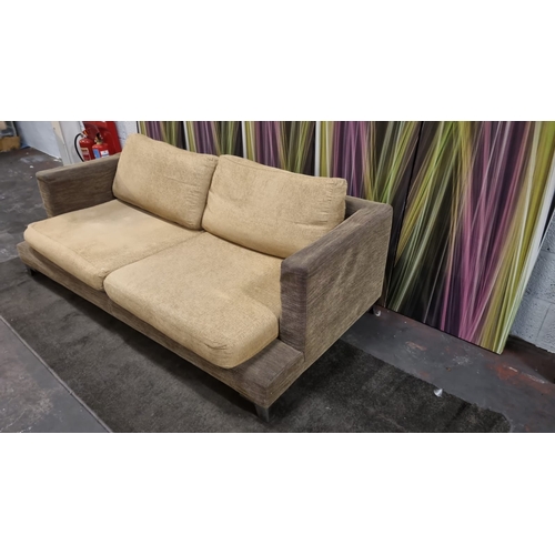 207 - A pair of large lobby sofas upholstered with loose cushions and polished metal legs 200 x 100 x 62cm... 