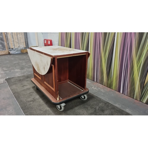 208 - 7  x mobile room service carts finished in custom wood veneer storage compartment features room for ... 