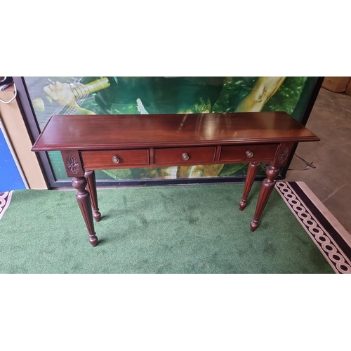 217 - A carved mahogany three drawer hall or console table 140 x 35 x 80cm ( This item is located in Bath)