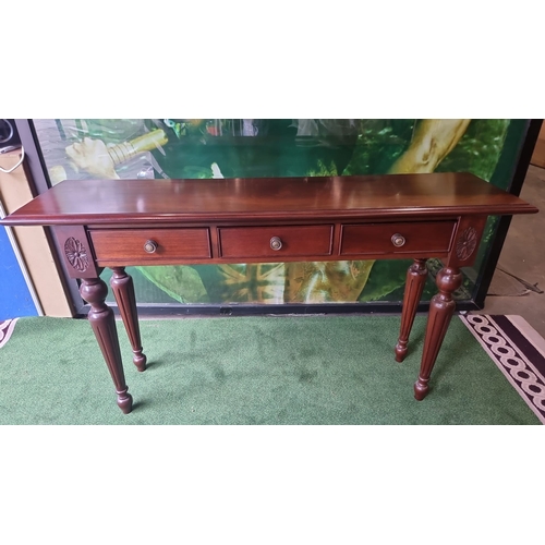 218 - A carved mahogany three drawer hall or console table 140 x 35 x 80cm ( This item is located in Bath)