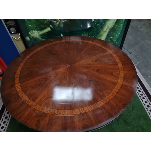 220 - A significant mahogany with banded inner border centre table 185cm diameter . Baluster pillar suppor... 