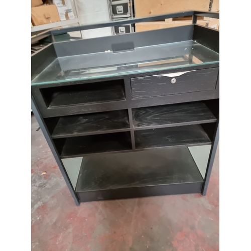 221 - Maitre D Dumb Waiter service station constructed in metal with wood and glass the rear with drawer a... 