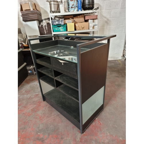 221 - Maitre D Dumb Waiter service station constructed in metal with wood and glass the rear with drawer a... 