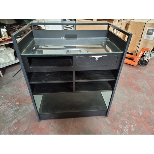 221 - Maitre D Dumb Waiter service station constructed in metal with wood and glass the rear with drawer a... 