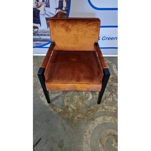 50 - Copper upholstered arm chair with padded arms on a dark wooden frame with tapering legs 60 x 70 x