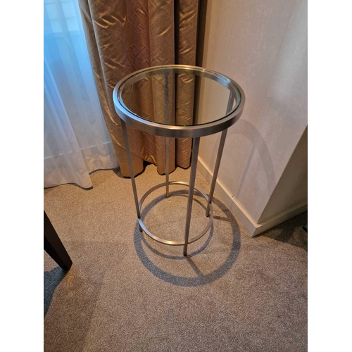 160 - A stainless steel and tempered glass side table 35cm diameter x 64cm tall (Room 1A)