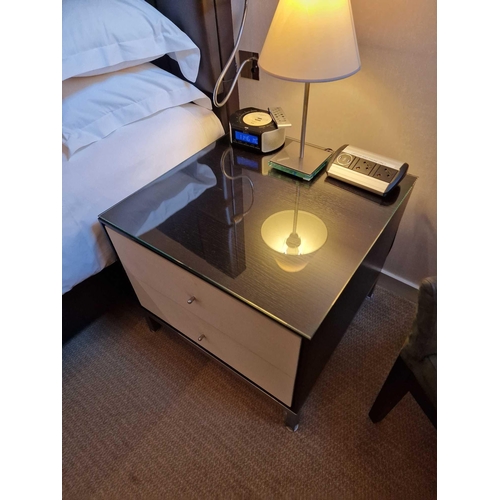 60 - A pair of bedside cabinets by Benhardt black ash mounted glass protective top on stainless steel bas... 