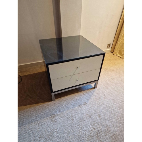 61 - A pair of bedside cabinets by Benhardt black ash mounted glass protective top on stainless steel bas... 