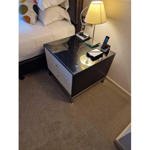 62 - A pair of bedside cabinets by Benhardt black ash mounted glass protective top on stainless steel bas... 