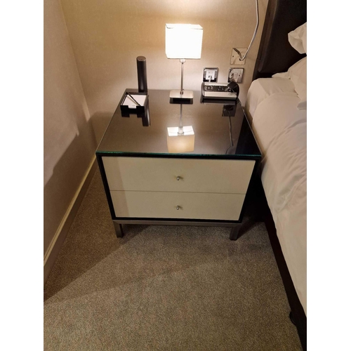 63 - A pair of bedside cabinets by Benhardt black ash mounted glass protective top on stainless steel bas... 