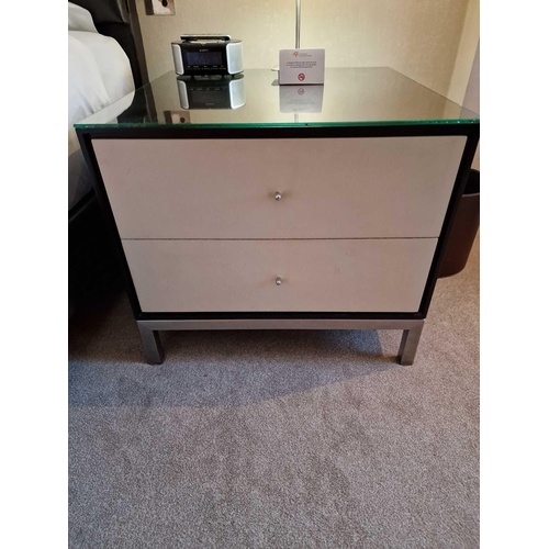 63 - A pair of bedside cabinets by Benhardt black ash mounted glass protective top on stainless steel bas... 