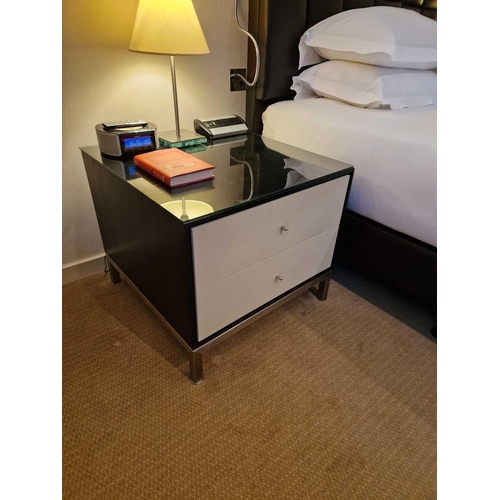64 - A pair of bedside cabinets by Benhardt black ash mounted glass protective top on stainless steel bas... 