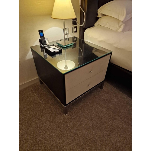 65 - A pair of bedside cabinets by Benhardt black ash mounted glass protective top on stainless steel bas... 