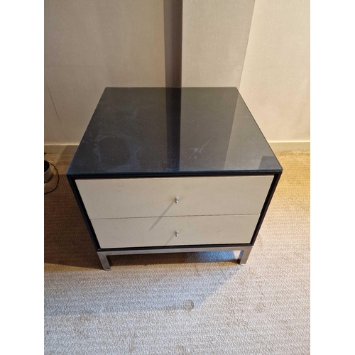 71 - A pair of bedside cabinets by Benhardt black ash mounted glass protective top on stainless steel bas... 
