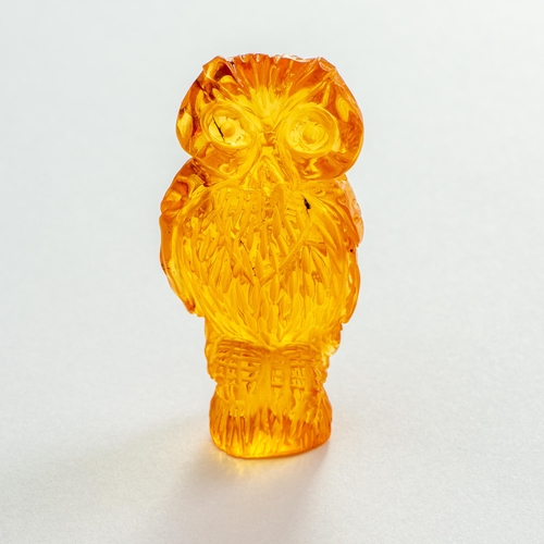 19 - Hand Carved Transparent Natural Baltic Amber Owl Figurine. Pleasant Orange colour, several petty inc... 