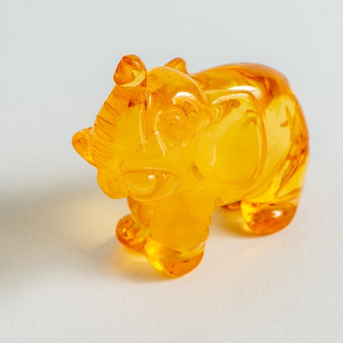 29 - Hand Carved semi-Transparent Natural Baltic Amber Elephant Figurine. Orange to Yellow colours, milky... 