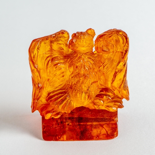 35 - Hand Carved Transparent Natural Baltic Amber Eagle on a Stand Figurine. Orange colour Amber with lim... 