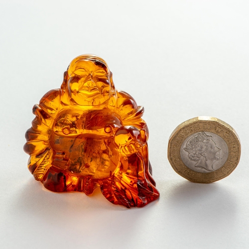 54 - Hand Carved Transparent Natural Baltic Amber Buddha Figurine. Clear and transparent Orange Amber wit... 