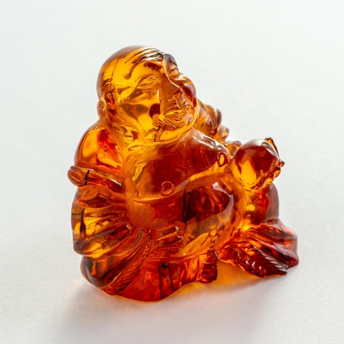 54 - Hand Carved Transparent Natural Baltic Amber Buddha Figurine. Clear and transparent Orange Amber wit... 