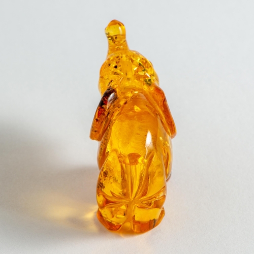 61 - Hand Carved Transparent Natural Baltic Amber Elephant Figurine. Light Orange colour Amber with visib... 