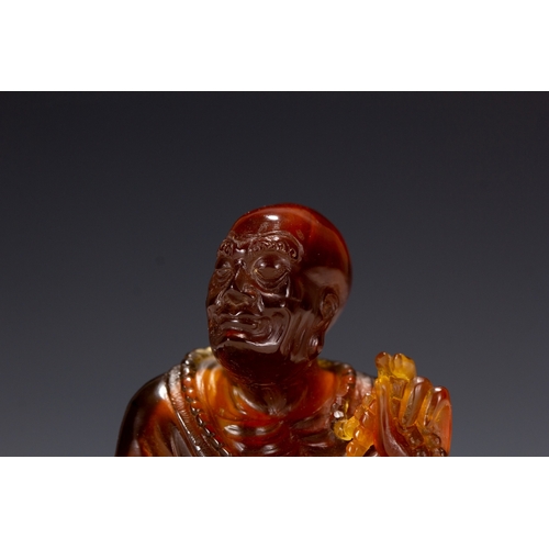 20129 - A Chinese amber made buddaha, 18th Pr. Size:(Height10cm, Width5.5cm, Length12cm, Weight190g) Conditi... 