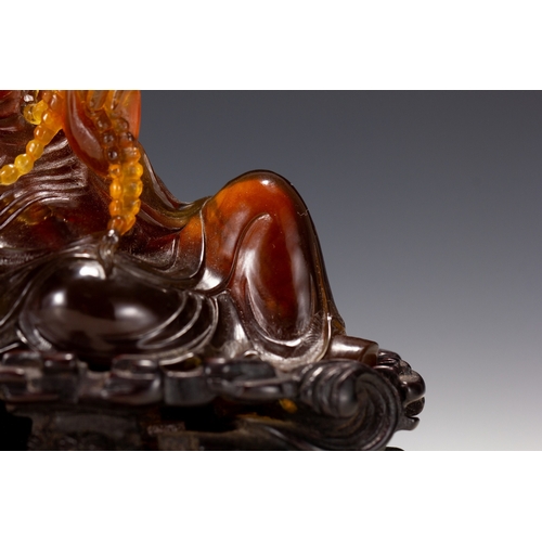 20129 - A Chinese amber made buddaha, 18th Pr. Size:(Height10cm, Width5.5cm, Length12cm, Weight190g) Conditi... 