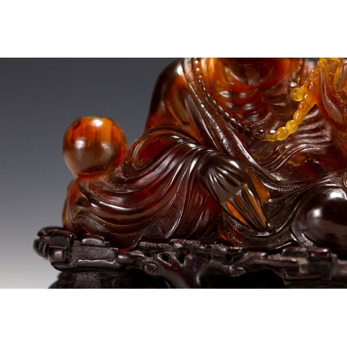 20129 - A Chinese amber made buddaha, 18th Pr. Size:(Height10cm, Width5.5cm, Length12cm, Weight190g) Conditi... 