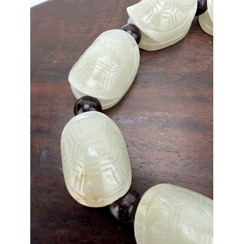 20226 - A Chinese jade ornament, 18th/19th Pr Size:(Each bead length2.5cm, Width2cm, Height1.5cm) Condition:... 