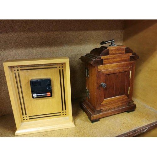 22 - Two wooden Clocks Including An Ornante Mahogany Cased One