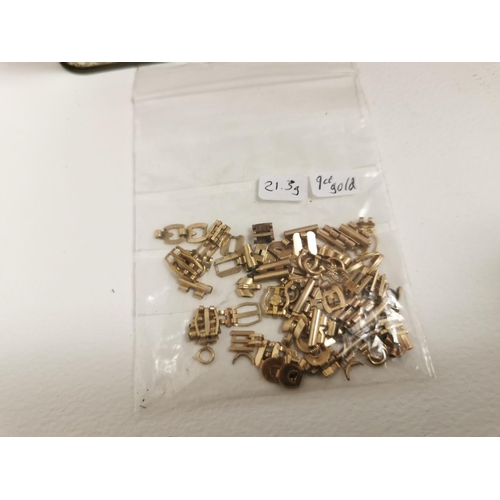 318 - Tin Full Of Jewelers Claps Chains And Links 9ct Gold Inc Bag Full Of Chains And Links Total Of 21.3g... 