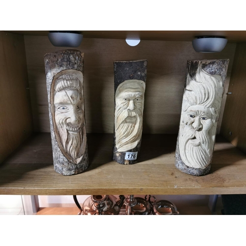 176 - Three Logs With Carved Faces