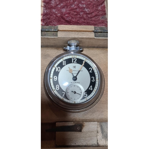 265 - Wooden cased Ingersol triumph pocket watch in a Mauchlin ware pocket watch case