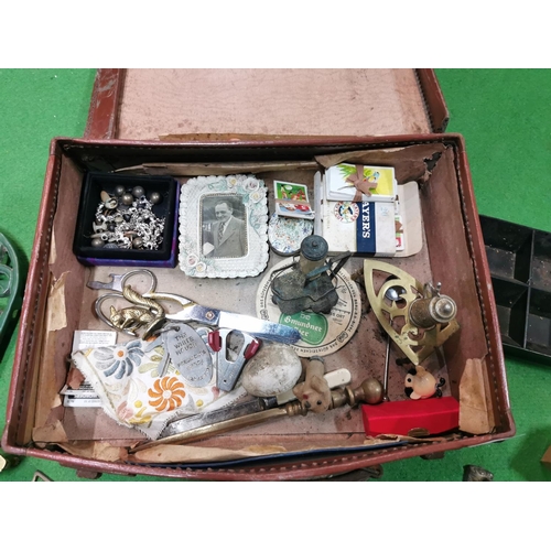 28 - Small brown attaché case full of collectables and sundries inc horse brasses boxed as new cigarette ... 