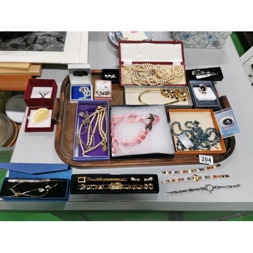 204 - Tray full of costume jewellery inc a good marcasite watch a quantity of as new brooches watch sets e... 