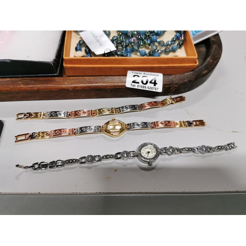 204 - Tray full of costume jewellery inc a good marcasite watch a quantity of as new brooches watch sets e... 