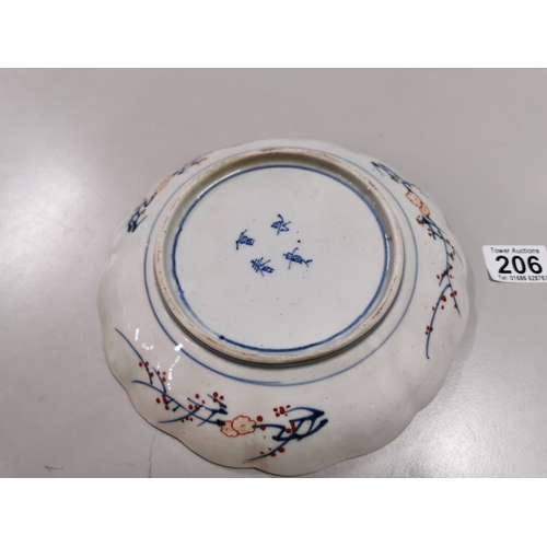 206 - Antique Japanese hand painted scallop rimmed plate, four blue character marks to the base (damage to... 