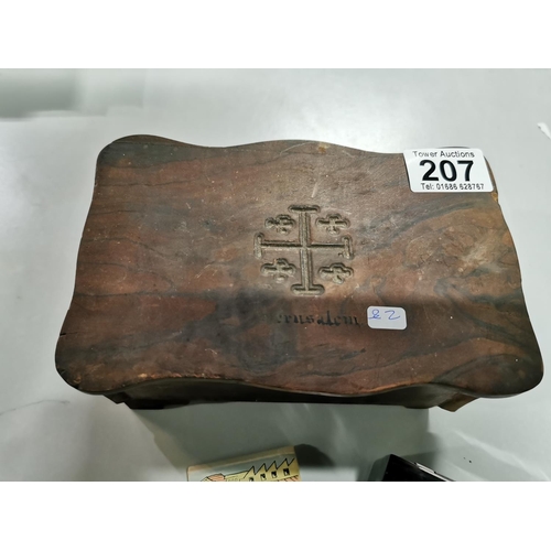 207 - Olive wood box carved with a cross with Jerusalem on top containing a quantity of marbles