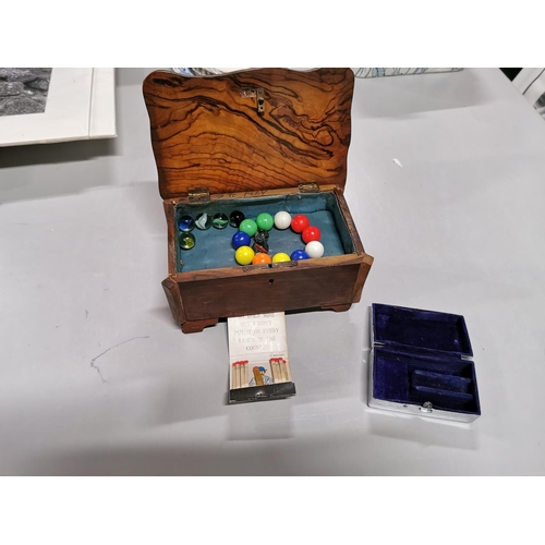 207 - Olive wood box carved with a cross with Jerusalem on top containing a quantity of marbles