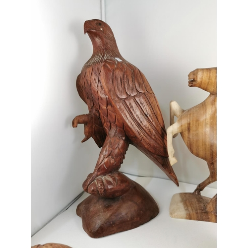 209 - Quantity of five hand carved figures inc a good tall solid wood carved Eagle figure (41cm) and good ... 