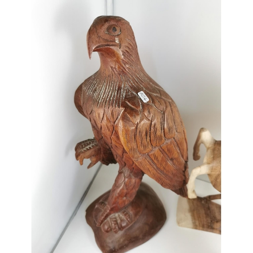 209 - Quantity of five hand carved figures inc a good tall solid wood carved Eagle figure (41cm) and good ... 