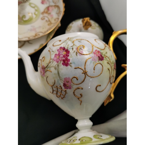 212 - Antique gilt and hand painted very pretty tea set complete possibly Limoges (one cup has hairline cr... 