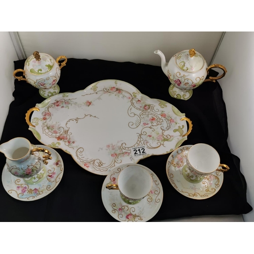 212 - Antique gilt and hand painted very pretty tea set complete possibly Limoges (one cup has hairline cr... 