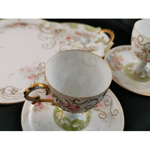 212 - Antique gilt and hand painted very pretty tea set complete possibly Limoges (one cup has hairline cr... 