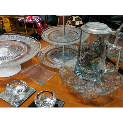 213 - Quantity of glass cake stands and candle holders