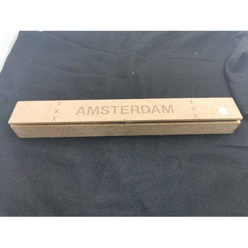 295 - Very large cased cigar marked Amsterdam, 31.5cm long width of 4cm