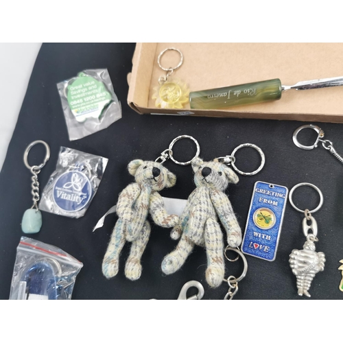 297 - Large quantity of various key rings inc two teddy keyrings a Michelin man key ring along with nurses... 