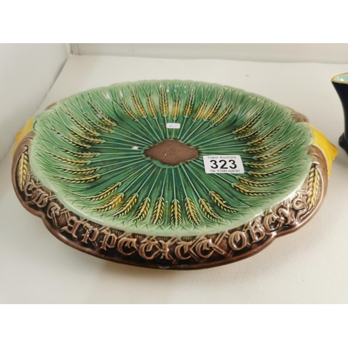 323 - Antique 19C Majolica wheat bread tray appetite obeys where reason rules, along with an antique Majol... 